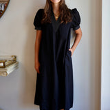 The V-Neck White Stitch Detail Dress in Black