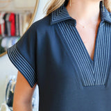The Black Dress with White Stitching
